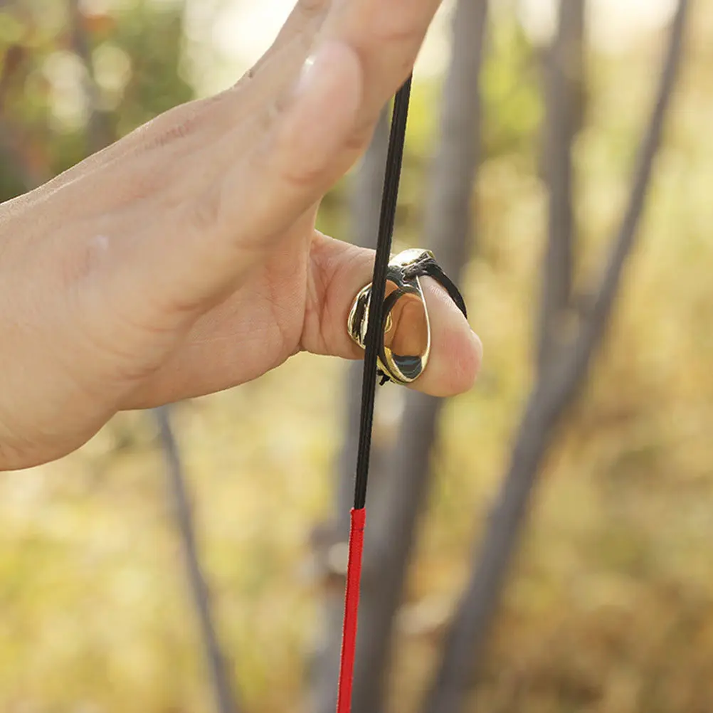 

1 комплект: латунное износостойкое профессиональное кольцо-накладка на большой палец для стрельбы из лука, традиционный аксессуар для стрельбы из лука, портативное снаряжение для охоты