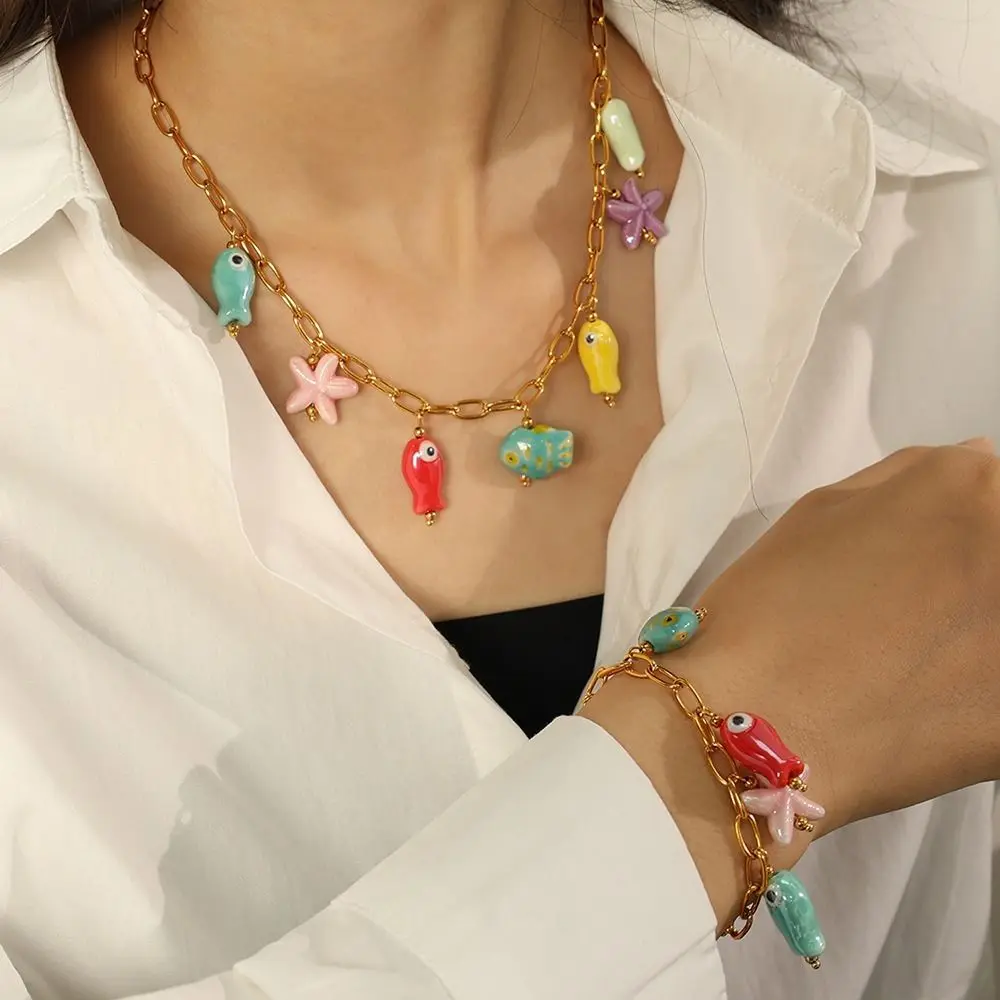 ไทเทเนียมเหล็กเซรามิคสร้อยคอปลาดาว Gold Vibrant Fish Drop สร้อยคอโซ่ปรับเสื่อมเสีย Ocean Theme สร้อยคอ