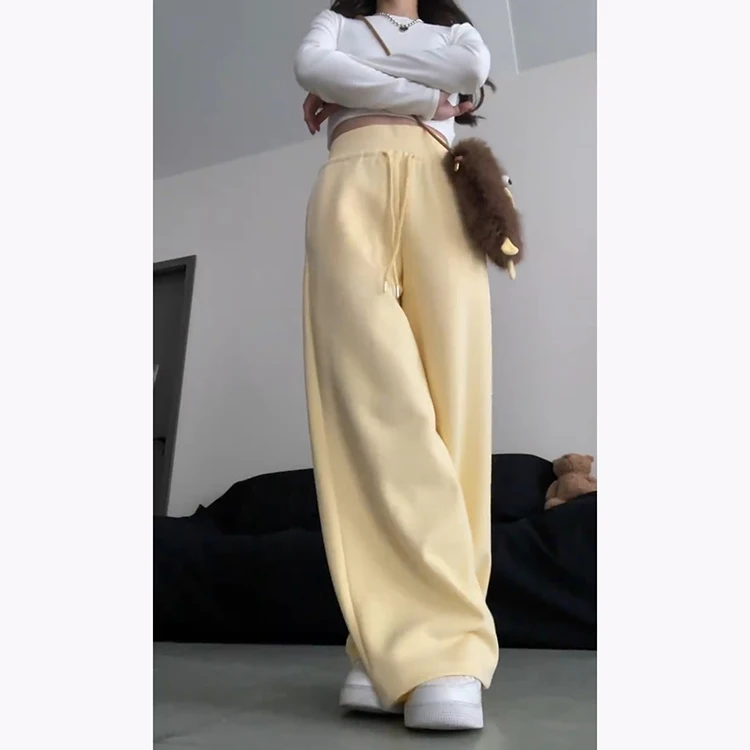กางเกงฮาเร็มลำลองสีเหลืองนมสำหรับผู้หญิง ฤดูใบไม้ผลิ-ฤดูร้อน 2025 รุ่นใหม่ ช่วยลดเลือนริ้วรอย ทรงหลวมพลิ้ว ช่วยให้ดูผอมเพรียว ทรงกระดิ่ง แฟชั่นเกาหลี...