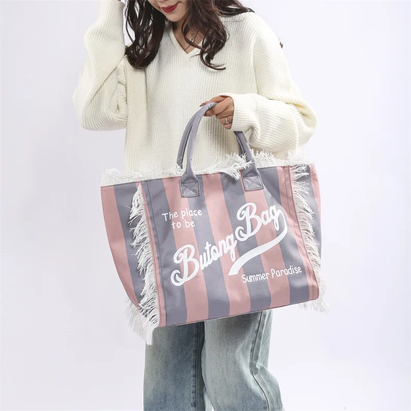 Popular Korean letters tassel canvas bag large-capacity bag simple commuting students to single shoulder Tote bag