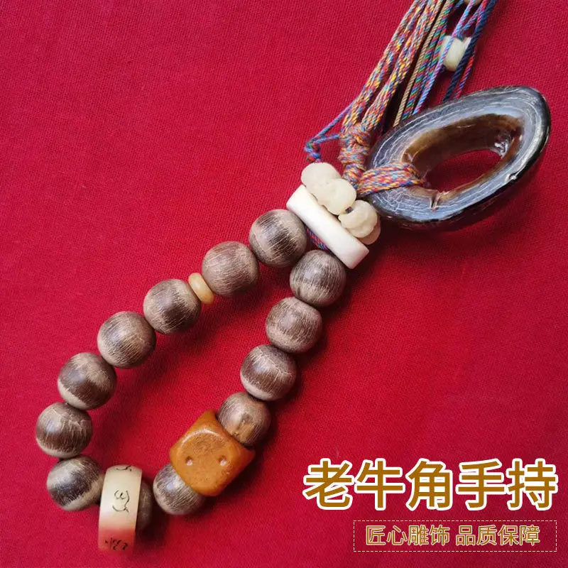 Tibetan-style old ox horn 18mm round beads paired with two dice a six-sided and a skull-shaped ring