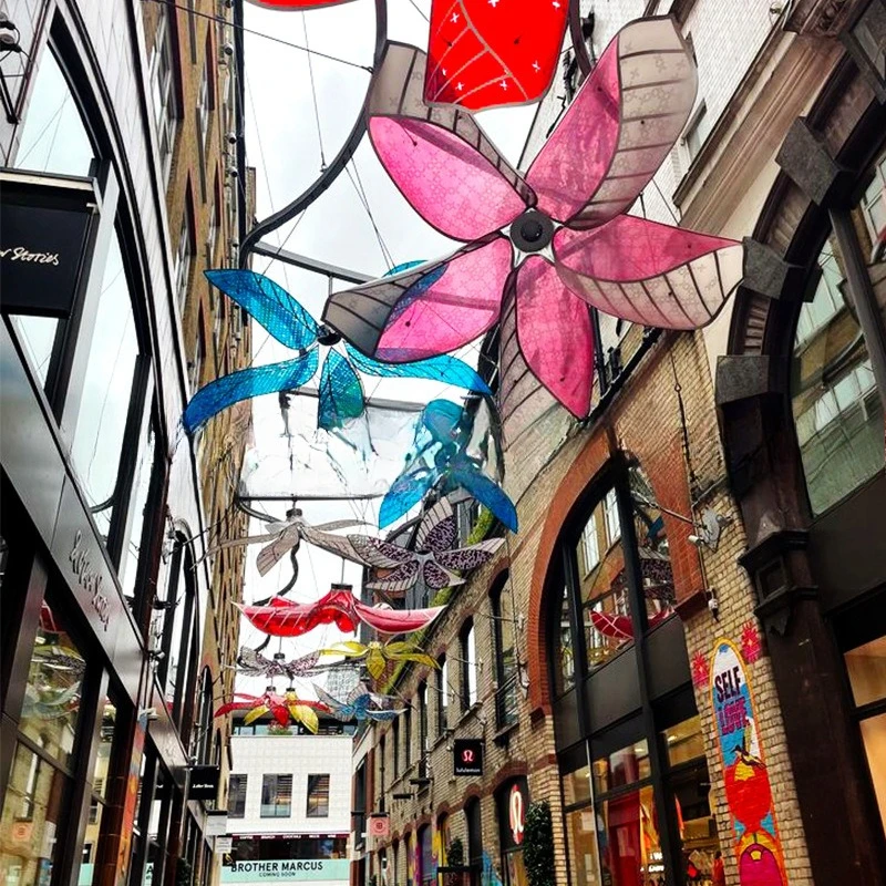 Outdoor shopping mall style street channel ceiling, simulated translucent colored flowers, cartoon atmosphere arrangement