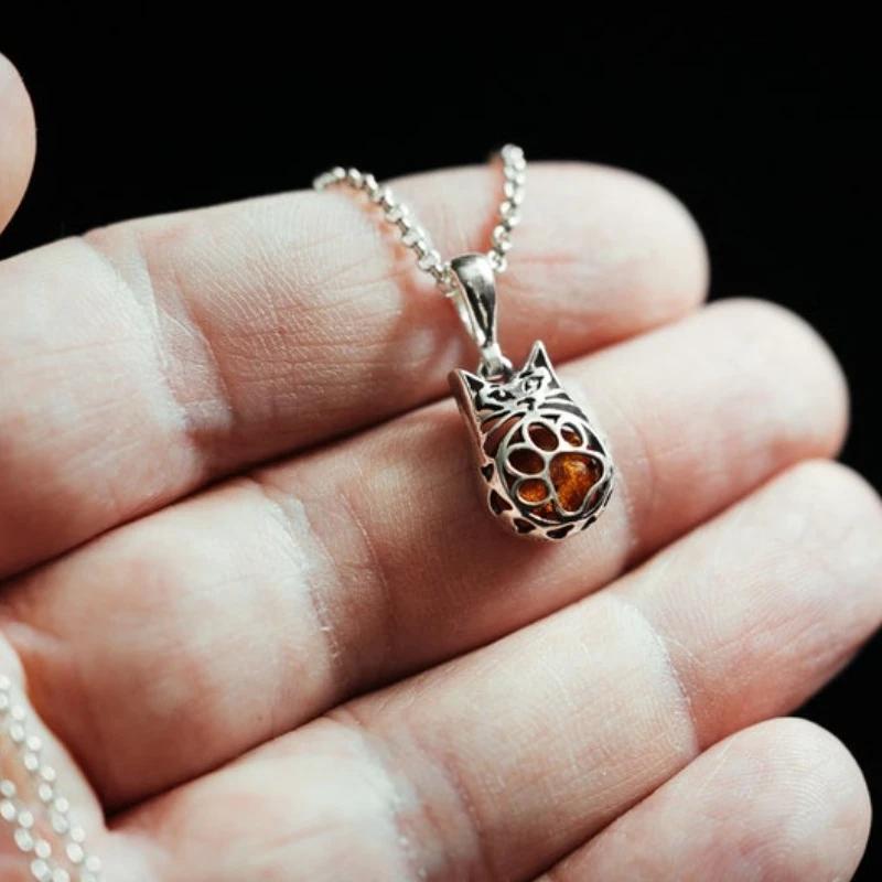 Silver Cat Pendant with Amber Inside and a cute paw on the belly Openwork  kitten Gift for cat lovers Three dimensions pet