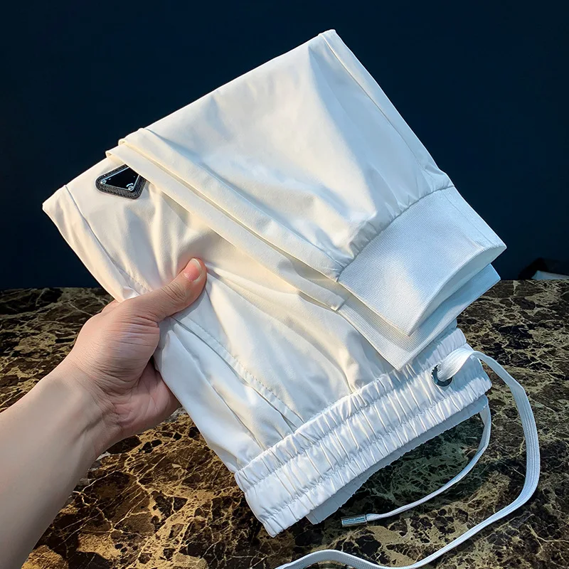 Pantalones deportivos informales ultrafinos de verano para hombre, pantalones ajustados de secado rápido, elásticos, ligeros y a la moda