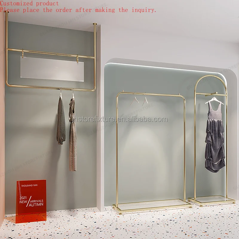 

Custom.Custom .Custom.Newest Design Wall Mounted Clothes Hanger Gold Stainless Steel Rack Boutique Store Display Shelves With Cu