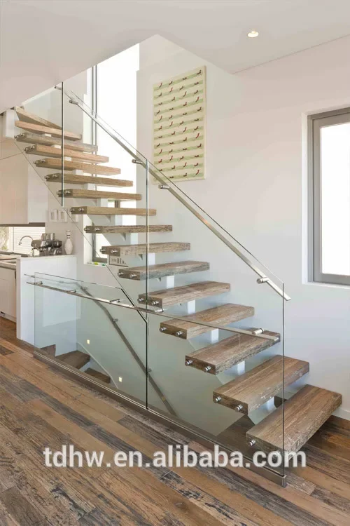 Single spine stringer stairs with 12mm frameless glazed balustrades and Flat bar handrails