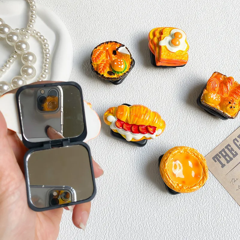 

Вращающийся держатель для телефона с рисунком Круассанов и яиц