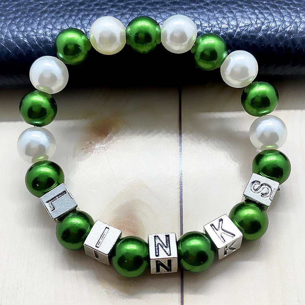 The links incorporated Inc sorority symbol metal letter bead tag green imitation pearl bracelet