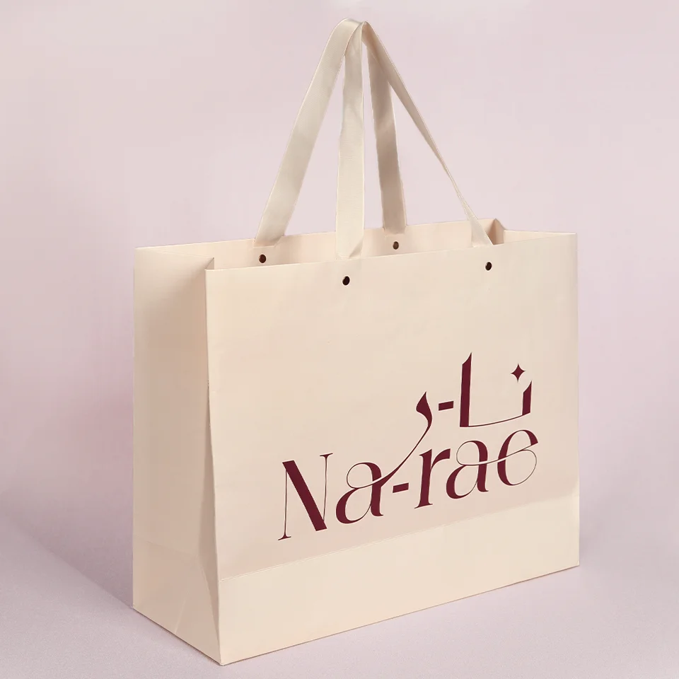 Custom Recycled  Luxury Cream Beige Shopping Paper Bags With Your Own Logo Ivory Clothes Packaging Gift Bag With Ribbon Handle