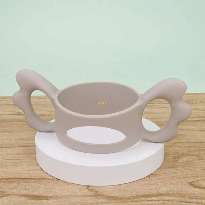 Hollow Out Baby Bottle حامل ، مقبض زجاجة قبضة يدوية صغيرة تصميم