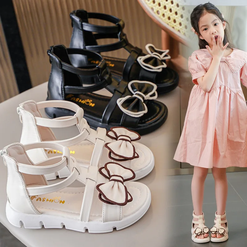

2025 Summer New Girls Sandals Fashion Soft Bottom Child Bow Roman Sandals Simple Anti Slip Kids Beach Shoes Zapatos De Mujer
