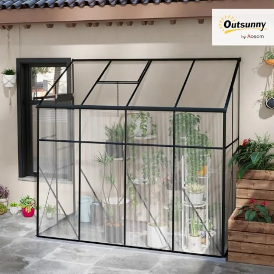 Lean-to polycarbonate greenhouse for backyard use, black frame with green translucent panels, features sliding door and durable