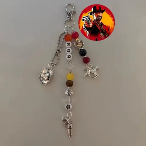 Inspired by video game accessories, Red Dead Redemption keychains by Sadie Adler, Arthur Morgan, and John Marston.