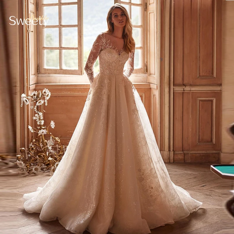 

Luxurious A-Line Wedding Dress Embroidered Lace On Net With Beading Ball Gown O-Neck Full Sleeve Bride Dress Button Robe De Mari