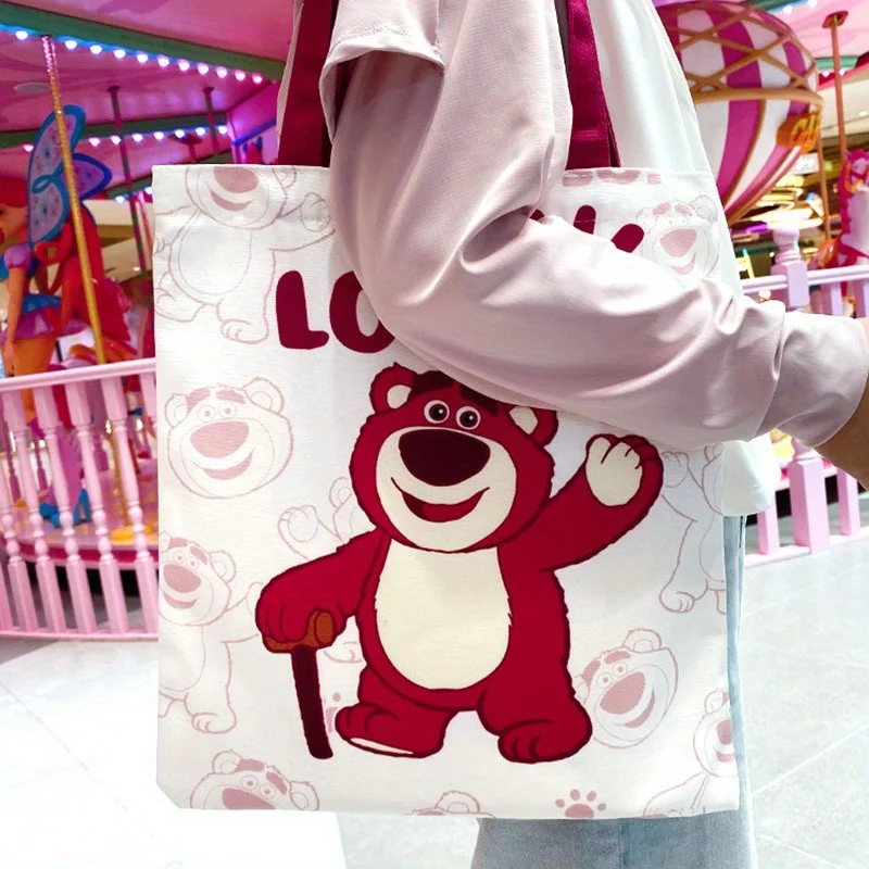 

PC Disney lotso cartoon carrying canvas bag Cute strawberry bear emoji bill shoulder bag, spring and summer travel must have