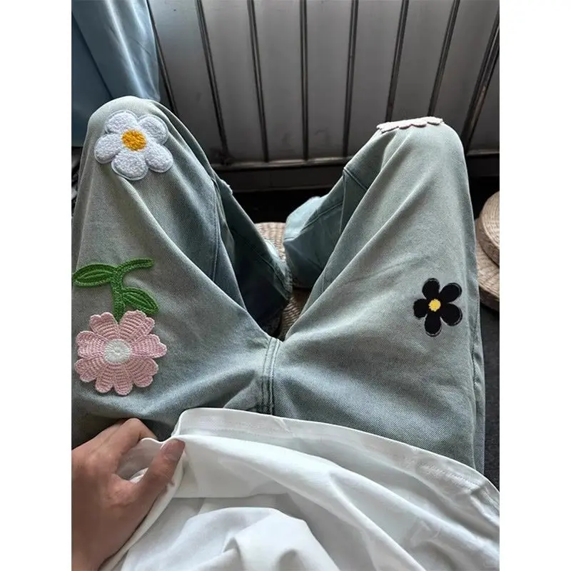 Hip hop trendy men and women retro personality flower embroidery micro flared jeans American hip-hop straight leg casual pants