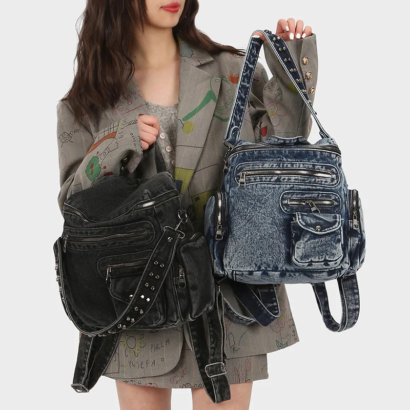 Old-fashioned denim motorcycle-style backpack with multiple pockets and rivets, wide single-shoulder bag