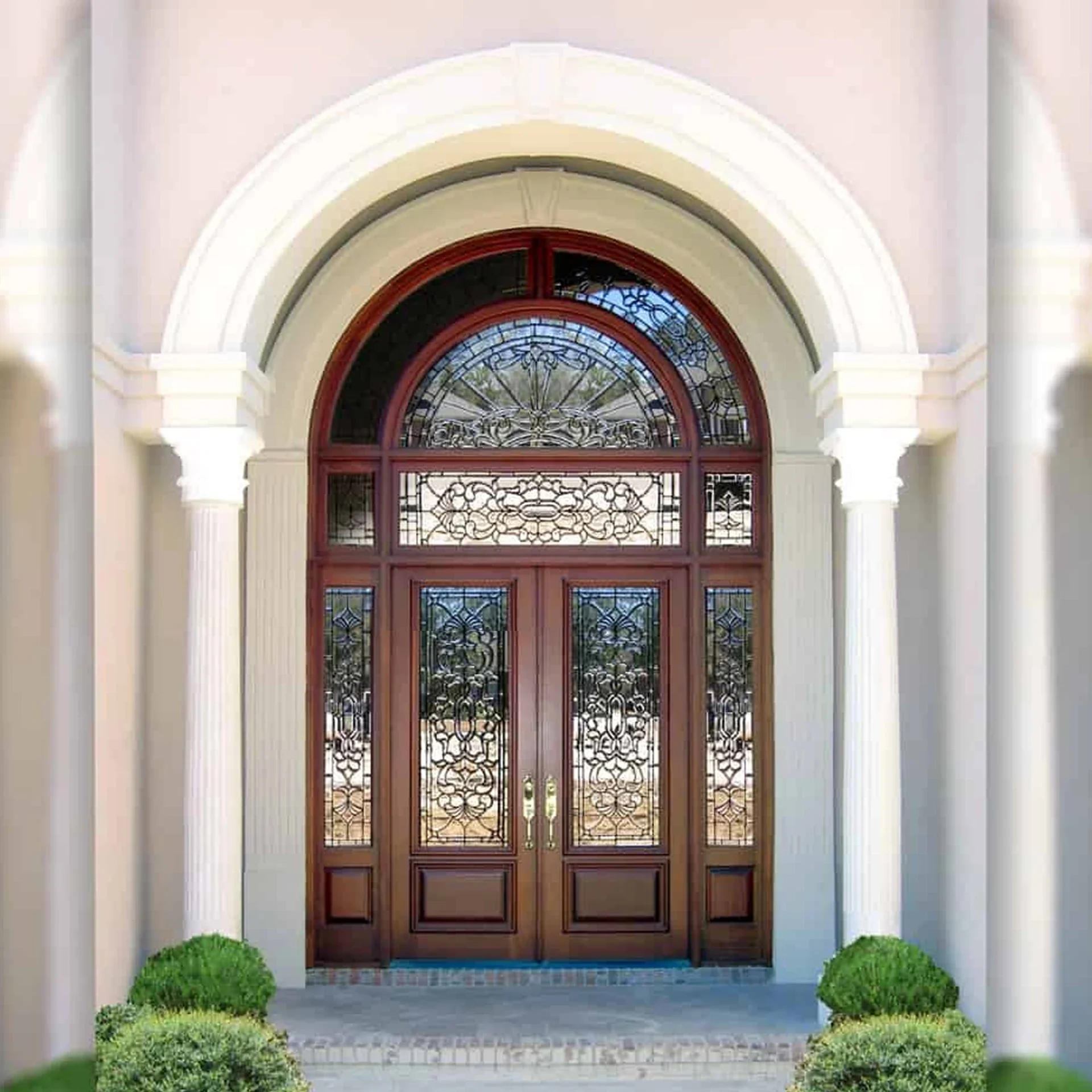 The American arched top glass is inserted into a crack free solid exterior wooden traditional front door design