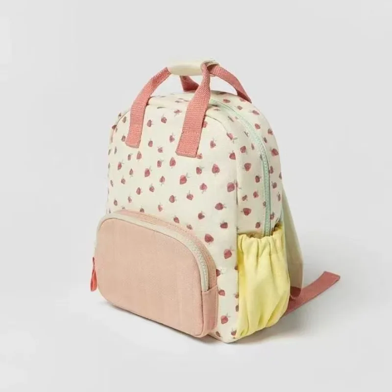 

Disney's Fashionable and versatile new canvas multi-badamine strawberry print color-matched double-shoulder backpack schoolbag