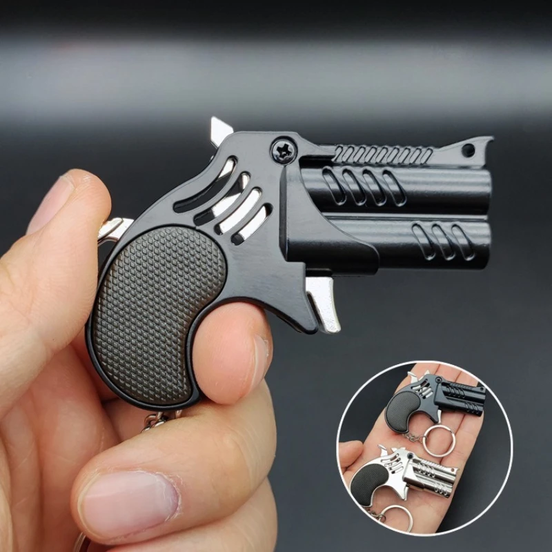 1Pcs Mini Keychain Metal Rubber Band Gun Game Toy Gun Launcher Adult Simulation Pistol Toys Gifts Pendent