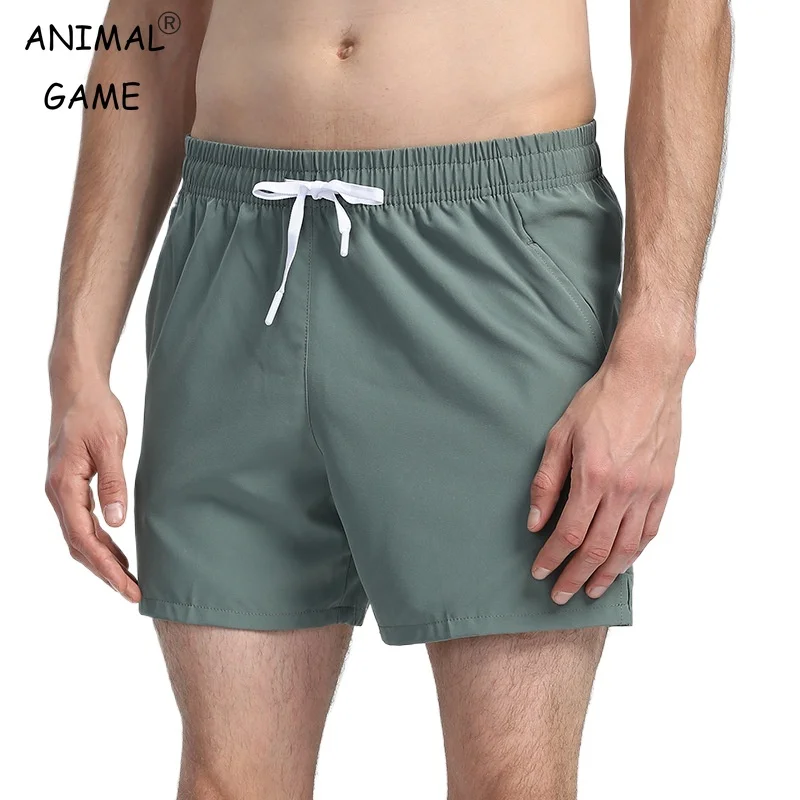 

Летние мужские спортивные шорты Тканые спортивные шорты сухой посадки с карманами на молнии на шнурке для спортивной одежды Повседневная уличная одежда