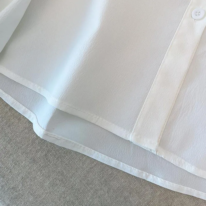 Blusa de manga abombada con volantes de estilo francés para mujer, camisas con solapa holgadas y elegantes de diseño coreano, camisetas blancas y negras de estilo universitario