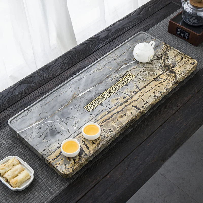 A traditional stone tea tray with a whole high-end rough stone, one piece of black gold