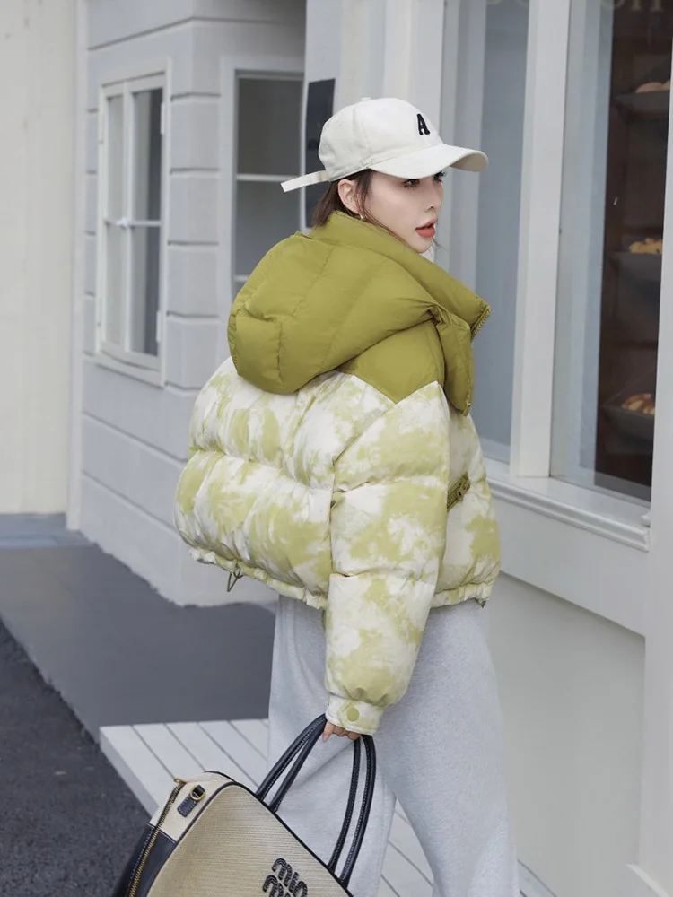 2025 Nuovo inverno stampato piumino da donna corto con cappuccio cravatta tinta design cappotto di pane addensato caldo piumino d'anatra bianco
