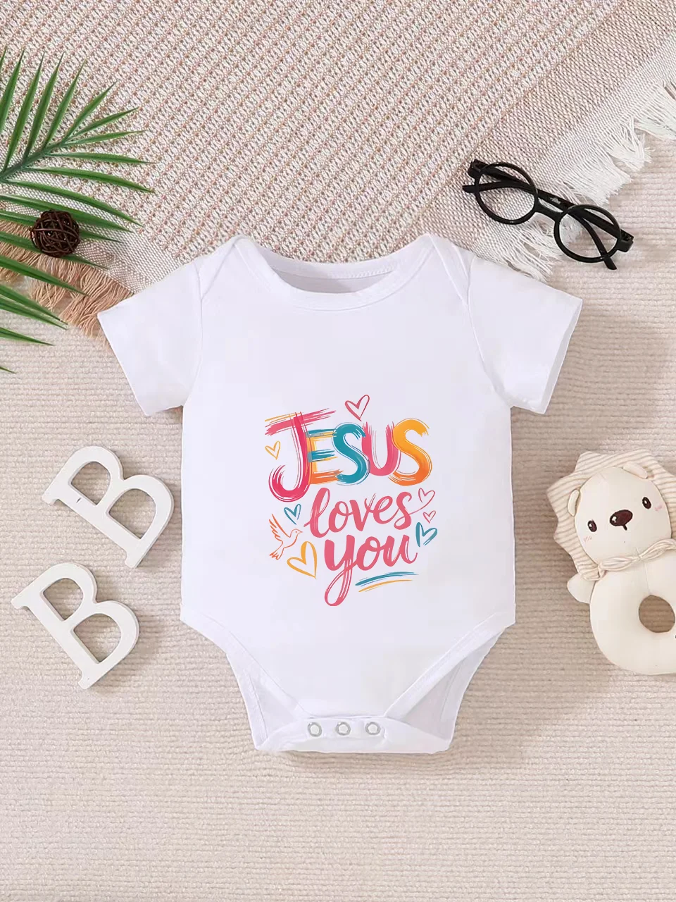 Picture 3: Playful letter-printed baby short-sleeve triangle bodysuit. Button closure for easy dressing, machine washable