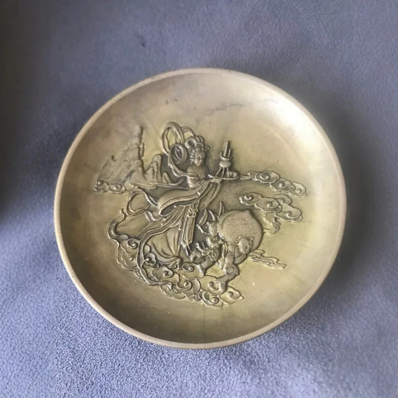 Collectible vintage craft items: decorative plates, antique brass Guanyin pen washers, and ornaments