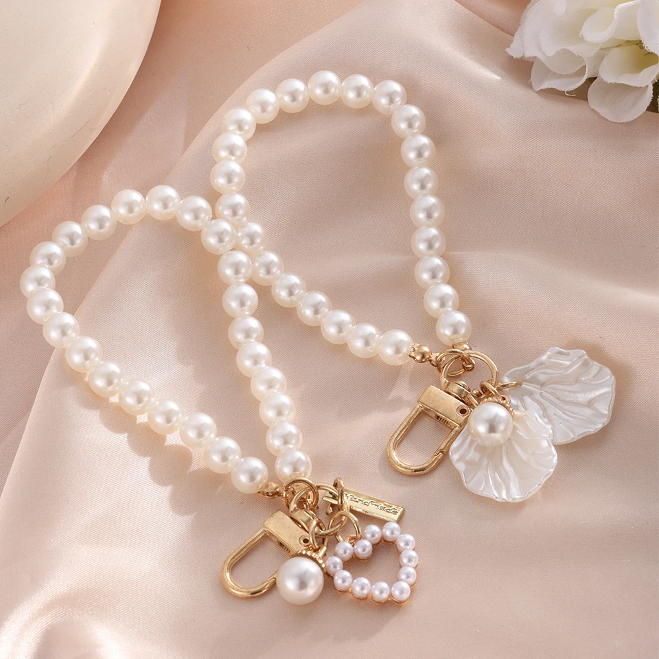 Yupsk 2 uds lindo Shell corazón arco imitación perla cuentas cadena colgante teléfono llavero imitación perla bolsa llavero