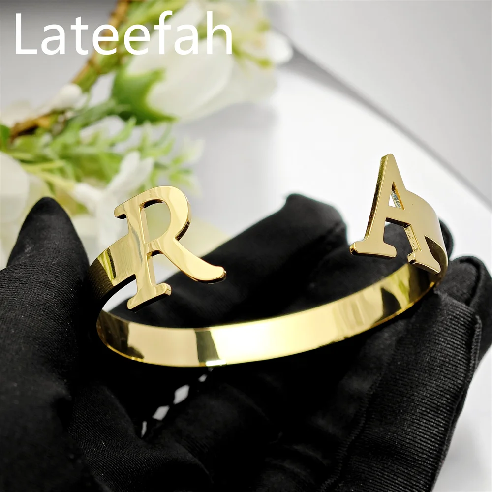 

Lateefah Stainless Steel 18K Gold Plated Colour Retention Custom Letter 18mm Height Cut C-shaped Opening Bangle