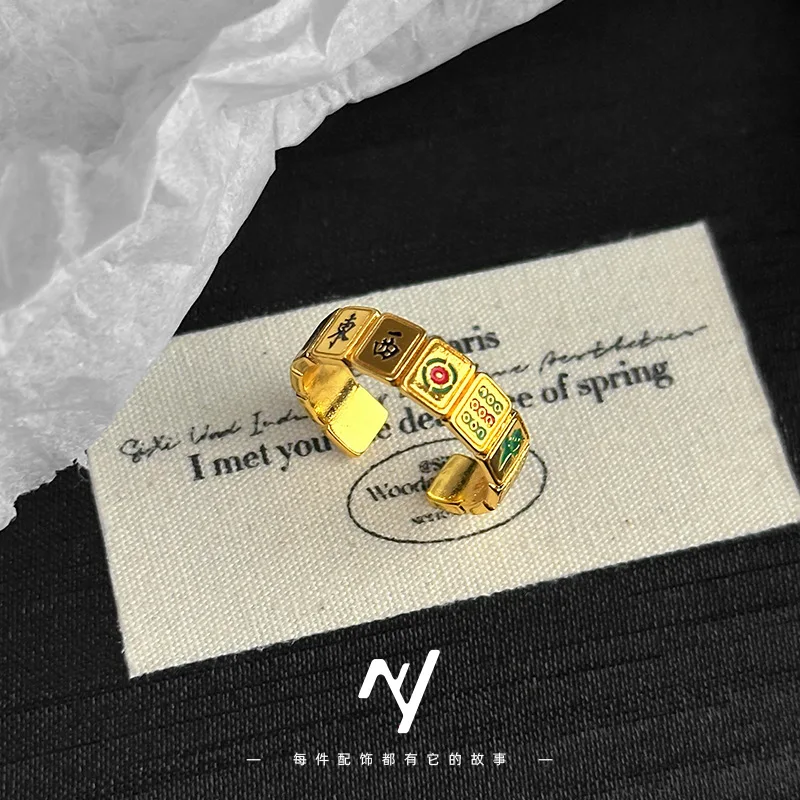 

A genuine gold 999 Thirteen Thirteen Mahjong national trend ring with a women's design sense and enamel color open