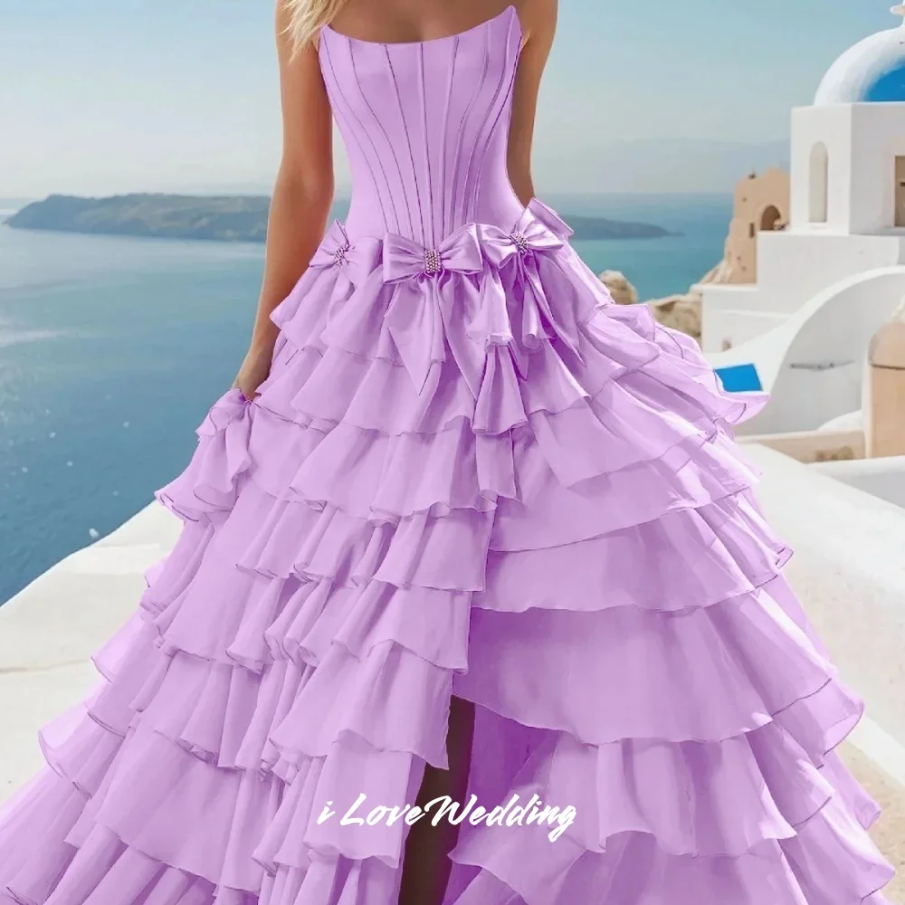 فستان حفلة موسيقية أزرق فاتح بدون حمالات 2025 بدون أكمام على شكل حرف a بفتحة جانبية بفيونكة متعددة الطبقات مطوي بطول الأرض فستان الحفلات حسب الطلب