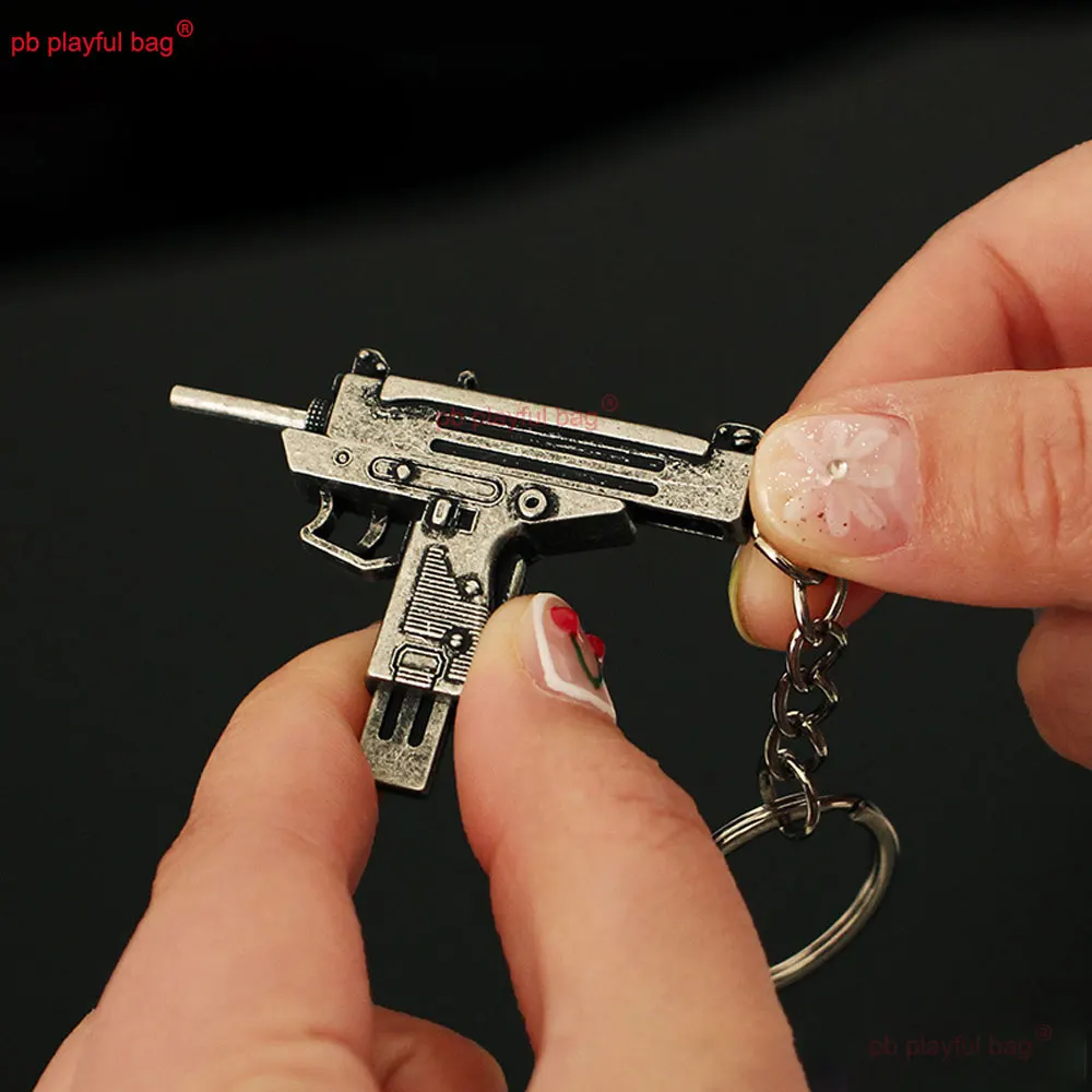 5cm Mini UZI arma de juguete modelo llavero colgante llavero de Metal extraíble decoración manualidades juego figura de acción regalos para niños ZG397