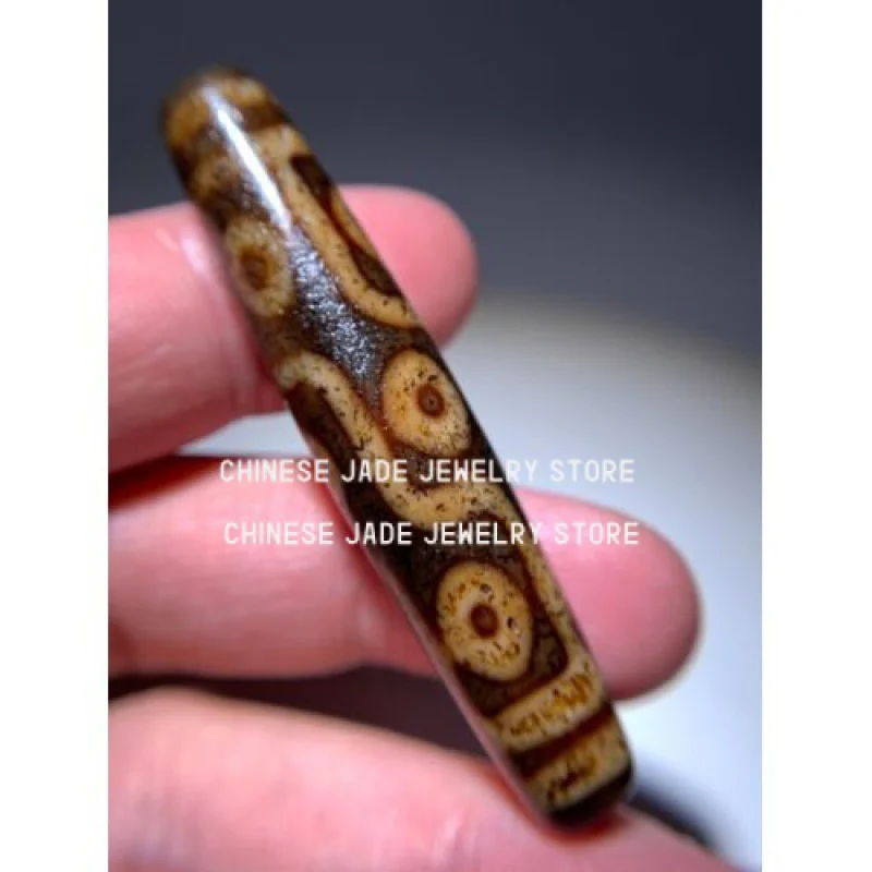 

Tibetan Old Agate Dzi Bead '9 Eyes ' Amulet Player 57mm x 11.6mm