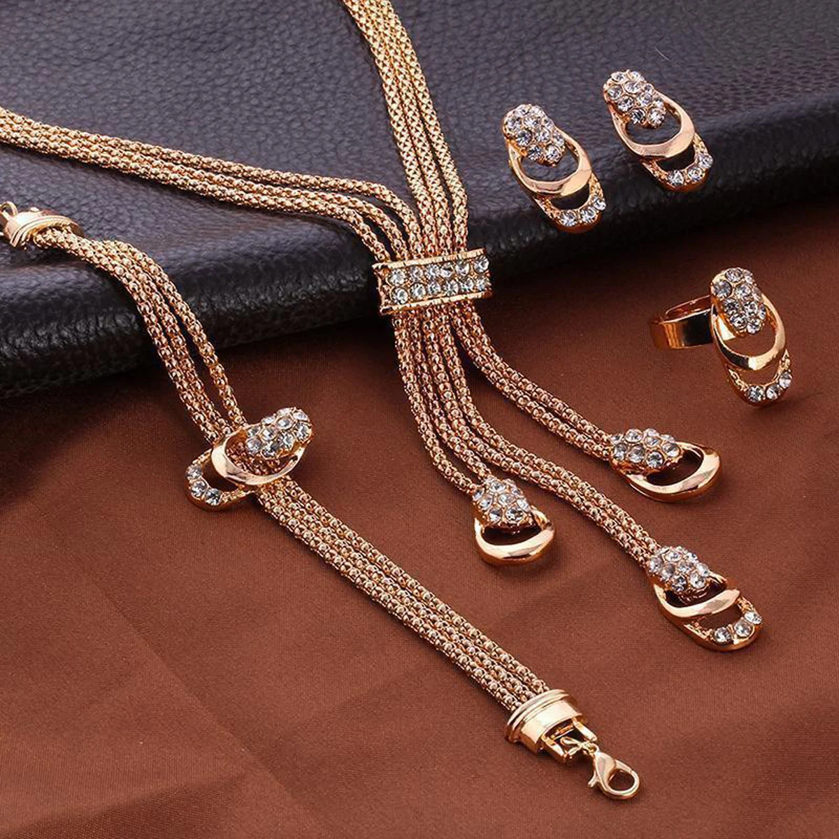 Cross border hot selling gold-plated exaggerated crystal jewelry set, creative bridal necklace, earrings, rings, four piece set