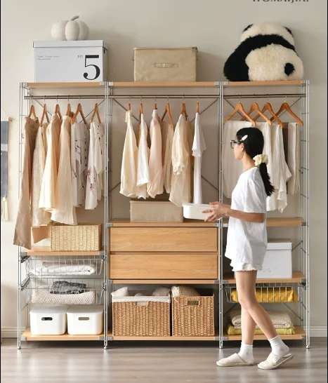 

Japanese floor mounted hanger minimalist steps into an open stainless steel wardrobe, wardrobe storage, hanger
