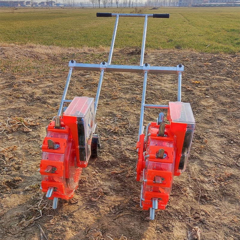 بذارة دفع يدويا صف مزدوج الذرة الفول السوداني أرز فول الصويا بذور اللفت متعددة الوظائف بذارة زراعية صغيرة الآلات الزراعية
