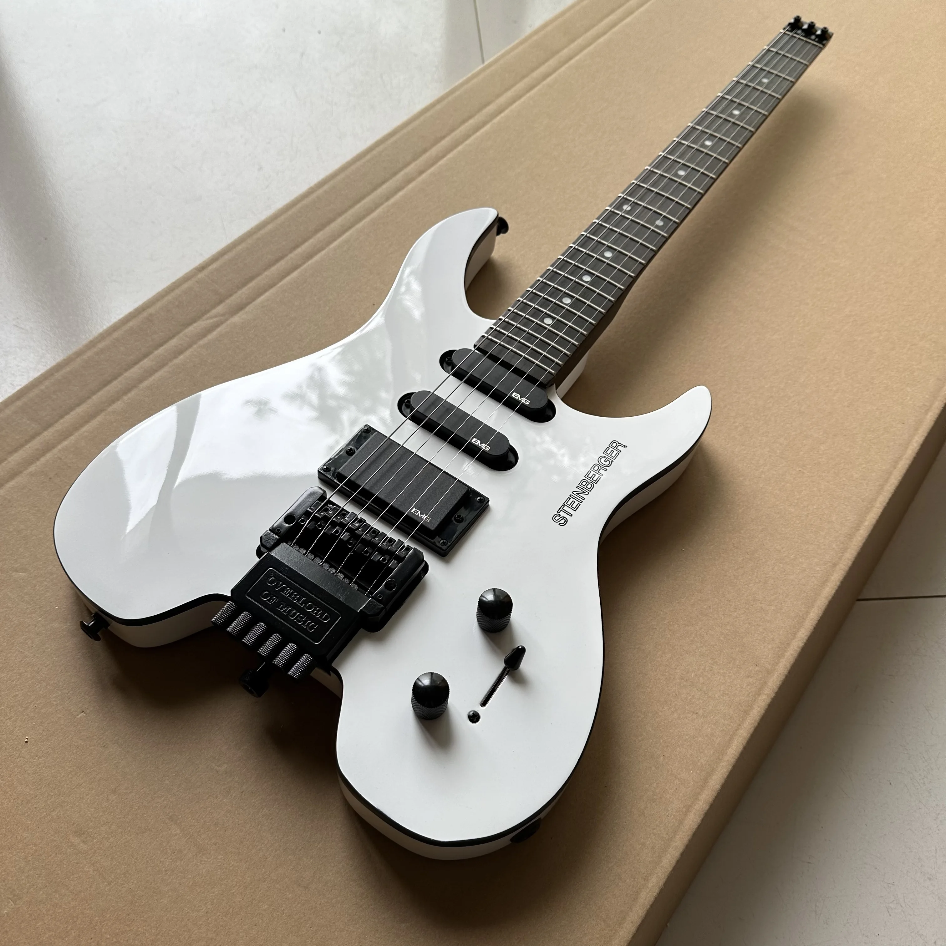 

Headless Electric Guitar, Mahogany Body, White Color, Floyd Rose Tremolo Bridge, 6 Strings Guitarra, Steinberger Version