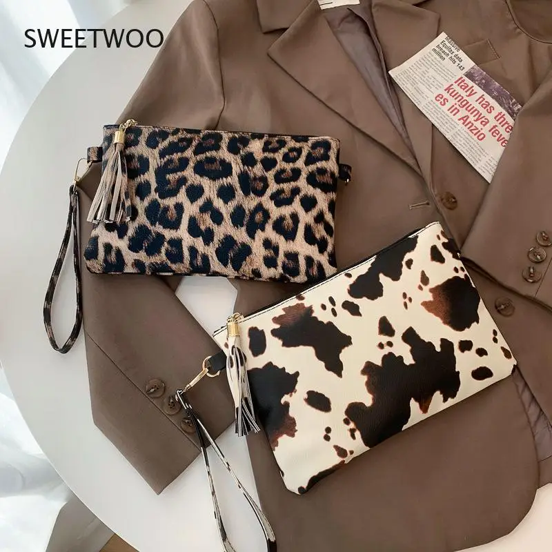 Borsa da polso geometrica con stampa di mucca leopardata in pelle PU borsa portaoggetti per telefono cellulare con moneta pochette da pranzo da donna