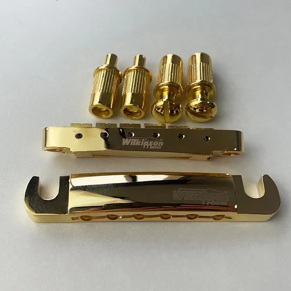 Vender como pan caliente-Accesorios para guitarra---Puente fijo para guitarra eléctrica. Código de placa de cuerda de tracción Dorado