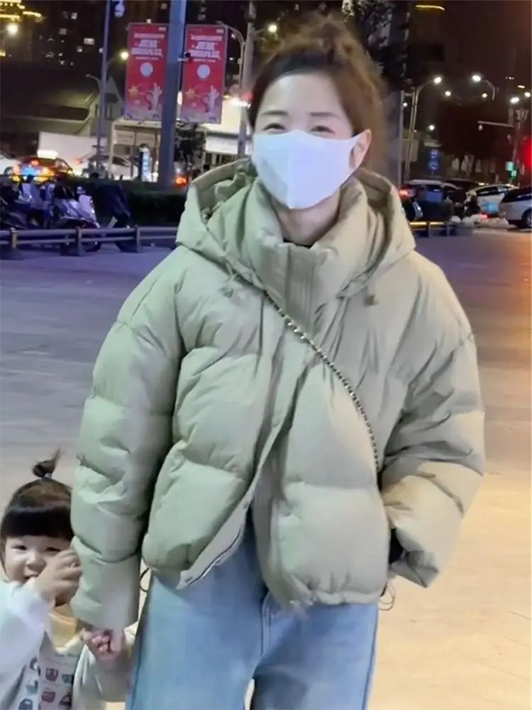 เสื้อโค้ทผู้หญิงแบบพัฟเฟอร์ ผ้าฝ้ายบุขนเป็ด สไตล์เกาหลี รุ่นใหม่ล่าสุดสำหรับฤดูหนาว พร้อมฮู้ด แฟชั่นทันสมัย