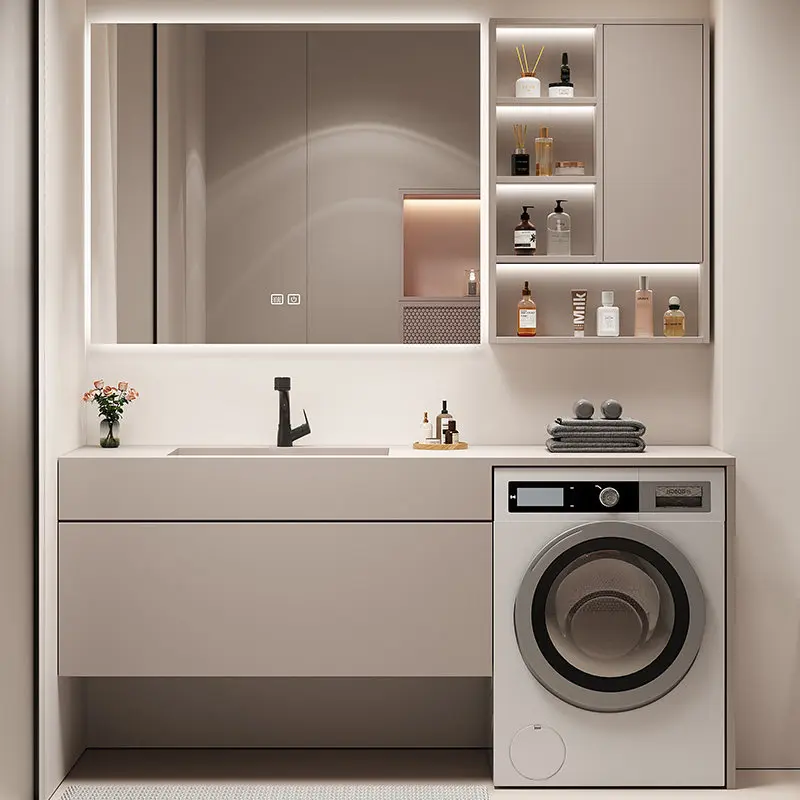 

Комбинация тумбы для стиральной машины из массива дерева, тумбы для ванной из каменной плиты и умывальника для туалета.