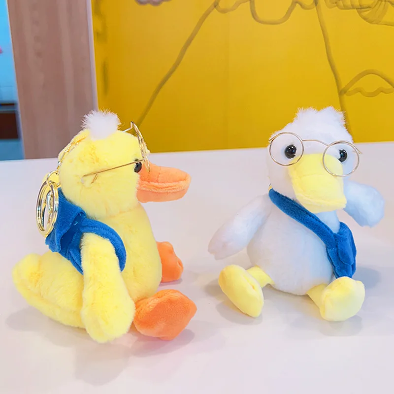 Animais de pelúcia Chaveiro de pelúcia Óculos fofos Brinquedos de boneca de pato Pingente de mochila Saco Keychain Acessórios de livros Saco de livro