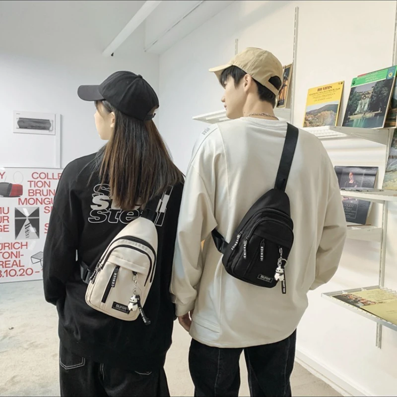 

2025 new work canvas chest bag men's ins Japanese casual students hundred with small satchel girls phone small backpack couple