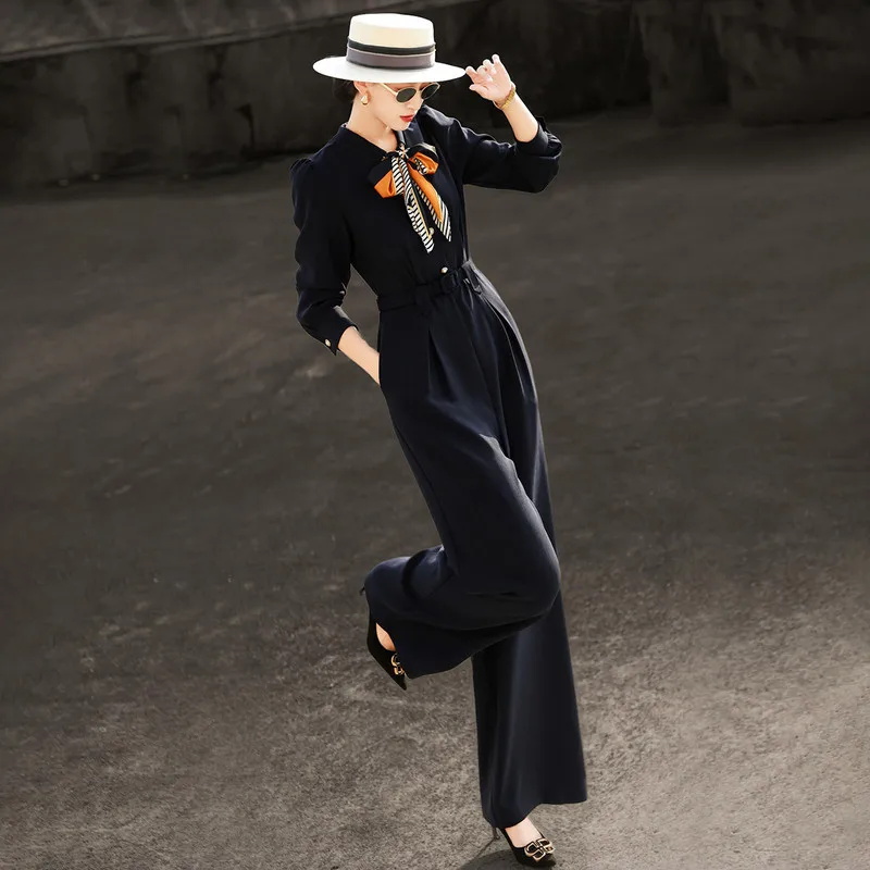 MEXCOCO 2026 Autumn Women Elegant Commuter Jumpsuit Color‑Block Silk Scarf Collar Single‑Breasted Waist‑Cinching Wide Leg Romper