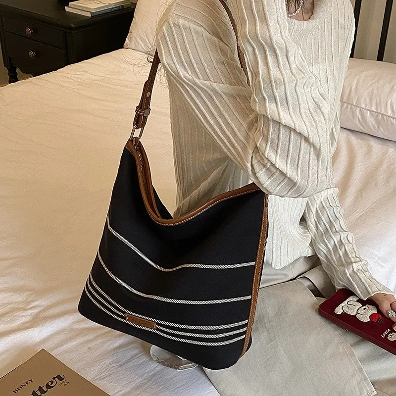 borsa-a-secchiello-casual-a-righe-grande-capacita-borsa-da-pendolare-nuova-borsa-a-tracolla-singola-da-donna-2026-trendy-e-pratica
