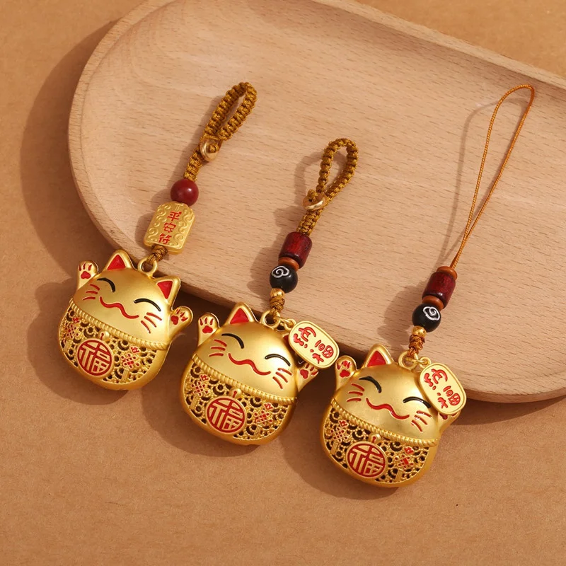 1Pcs Golden Maneki Neko Hanging Ornament Hollow‑out Fu Character Lucky Cat Pendant Braided Rope Beaded Tassel Bag Phone Charm Oriental Folk Decor Gift