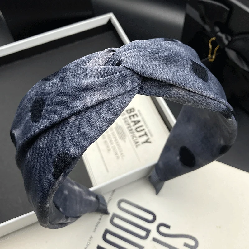 New wide edged polka dot headband for women, worn externally with a high skull top to show off a small face, versatile and niche